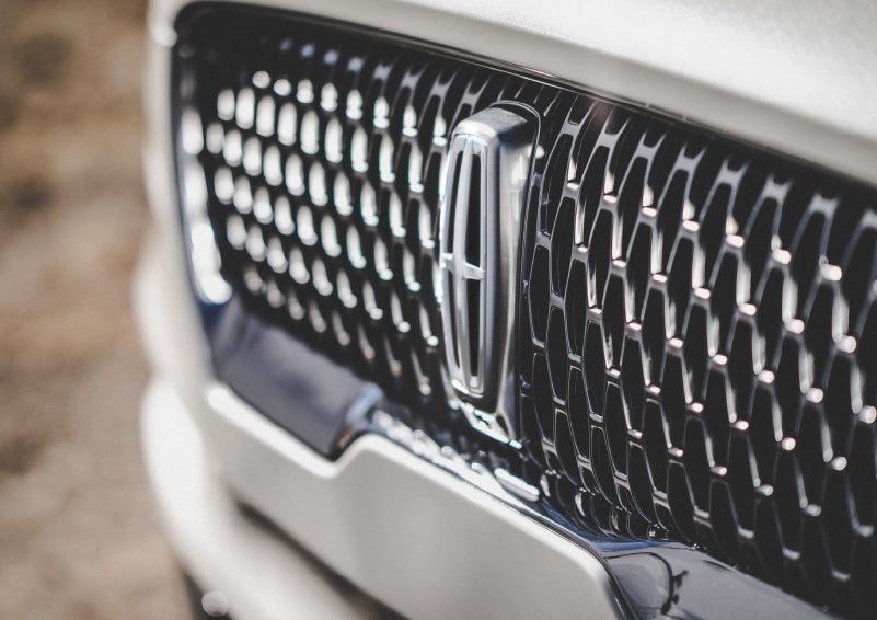 The grille of the 2024 Lincoln Aviator® Reserve model with an eye-catching repeated field of Lincoln Star logo shapes | Allan Vigil Lincoln, Inc. in Morrow GA
