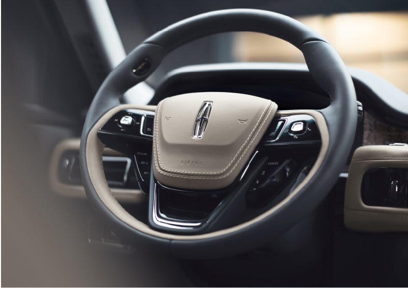 The intuitively placed controls of the steering wheel on a 2023 Lincoln Aviator® SUV | Allan Vigil Lincoln, Inc. in Morrow GA