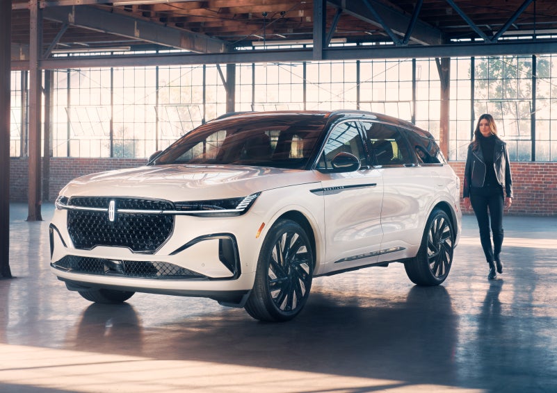 A person approaches a 2024 Lincoln Nautilus® SUV. | Allan Vigil Lincoln, Inc. in Morrow GA