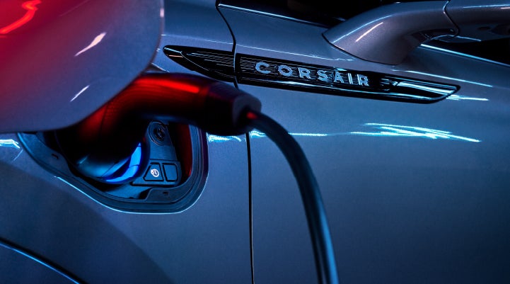 A charger plugged into the charging port of a 2024 Lincoln Corsair® Plug-in Hybrid model. | Allan Vigil Lincoln, Inc. in Morrow GA