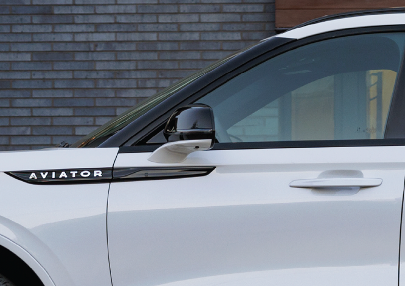 The driver’s door of a white 2025 Lincoln Aviator® SUV is showcased. | Allan Vigil Lincoln, Inc. in Morrow GA