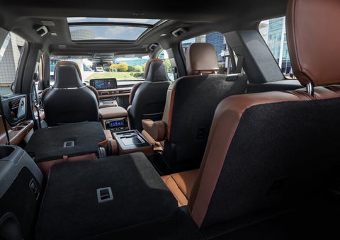The interior of the 2025 Lincoln Aviator® SUV is shown with two seats folded down for added space. | Allan Vigil Lincoln, Inc. in Morrow GA