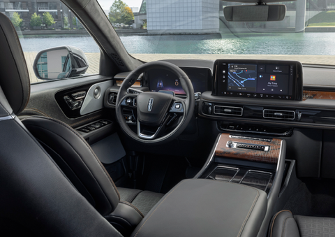 The interior of the 2025 Lincoln Aviator® SUV is shown parked with a view of a harbor through the windshield. | Allan Vigil Lincoln, Inc. in Morrow GA