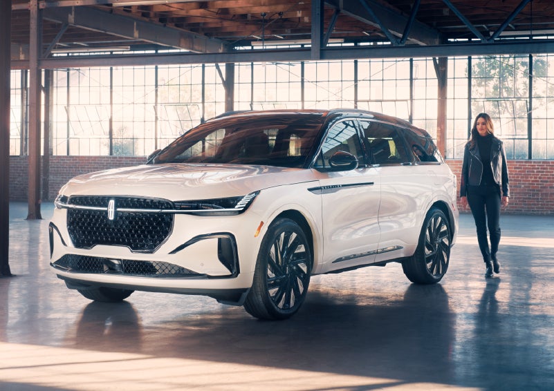 A person approaches a 2025 Lincoln Nautilus® SUV. | Allan Vigil Lincoln, Inc. in Morrow GA