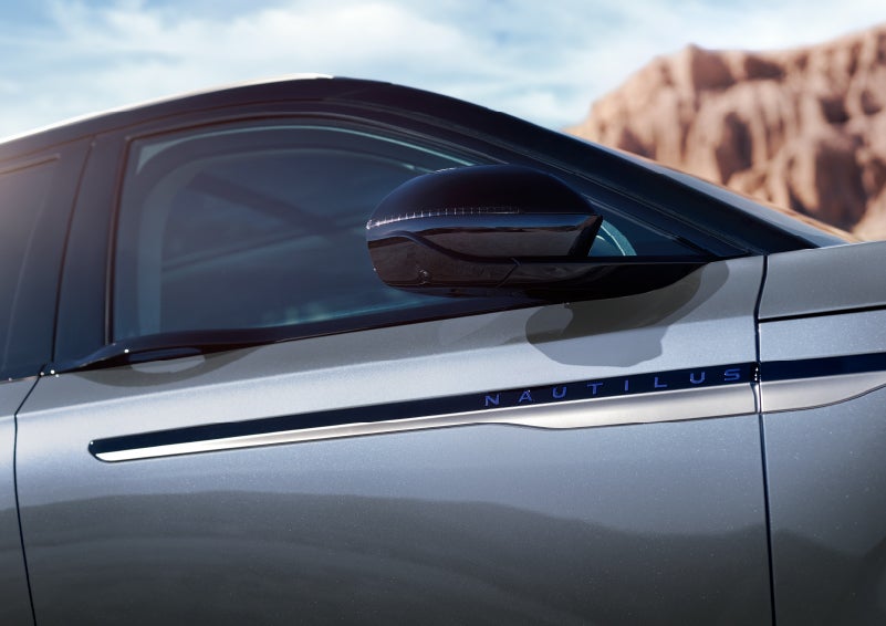 Blue lettering on the side of the vehicle that reads nautilus indicates the available hybrid powertrain. | Allan Vigil Lincoln, Inc. in Morrow GA
