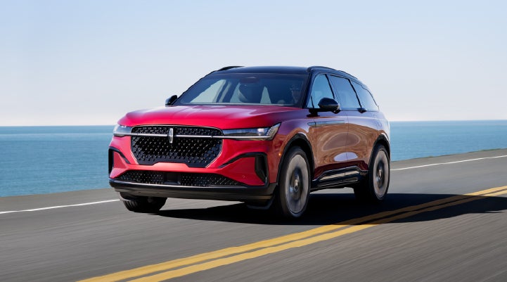 A 2026 Lincoln Nautilus® SUV is being driven on a seaside roadway. | Allan Vigil Lincoln, Inc. in Morrow GA