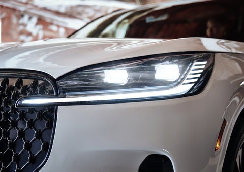 A close-up of a headlamp on the 2027 Lincoln Aviator® SUV is shown. | Allan Vigil Lincoln, Inc. in Morrow GA