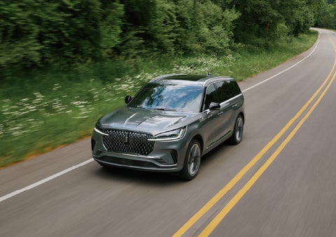 A 2027 Lincoln Aviator® SUV is being driven down a road. | Allan Vigil Lincoln, Inc. in Morrow GA
