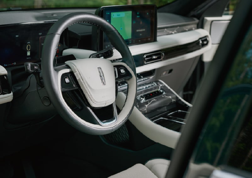 The leather-trimmed steering wheel of a 2027 Lincoln Aviator® Black Label™ SUV. | Allan Vigil Lincoln, Inc. in Morrow GA