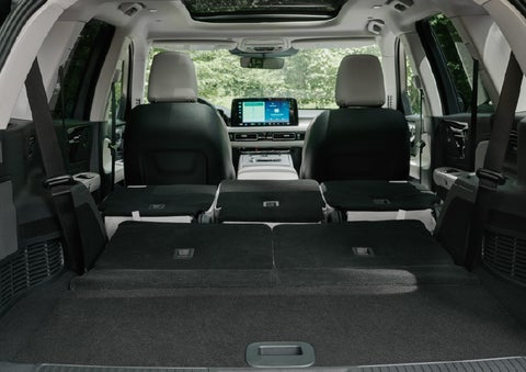 A rear to front view of the interior of a 2027 Lincoln Aviator® Black Label™ SUV shows the third and second rows folded flat | Allan Vigil Lincoln, Inc. in Morrow GA